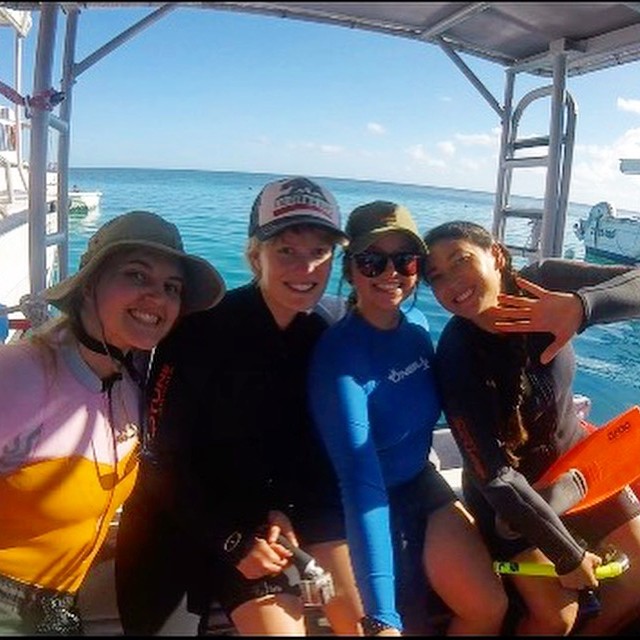 Wildlife biologists on a boat for marine surveys